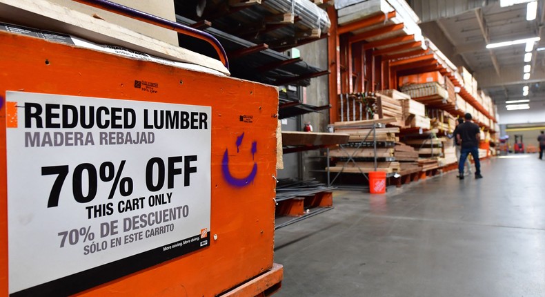 A discounted batch of planks is seen as people shop for lumber at a Home Depot store in Alhambra, California on May 4, 2022.