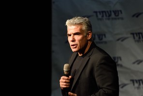 Yair Lapid, leader of 'Yesh Atid' Party and former Israeli Finance Minister speaks to supporters in 