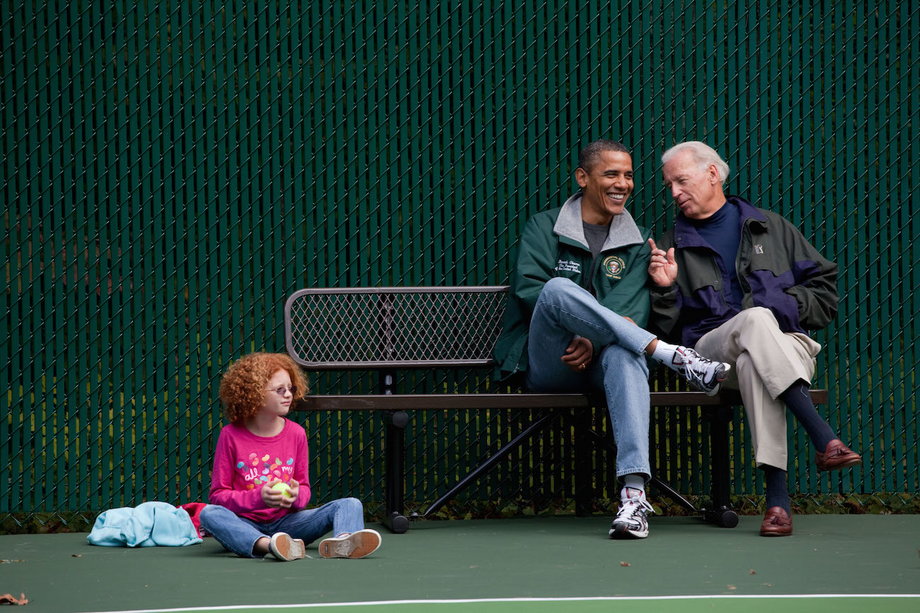 Obama, Biden, and Claire Duncan, daughter of then-Education Secretary Arne Duncan, watch a tennis match at Camp David, Maryland, October 3, 2010.