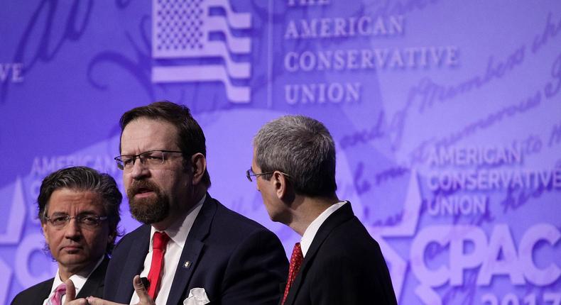 President Trump's deputy assistant, Sebastian Gorka, center, and the founder of the American Islamic Forum for Democracy, Zuhdi Jasser, left, at CPAC on February 24, 2017.