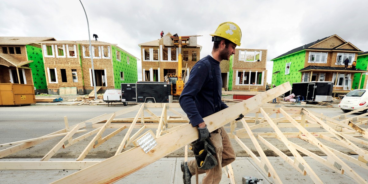 A construction worker building new homes in Calgary, Alberta.