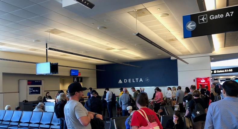 Passengers wait at a Delta gate.