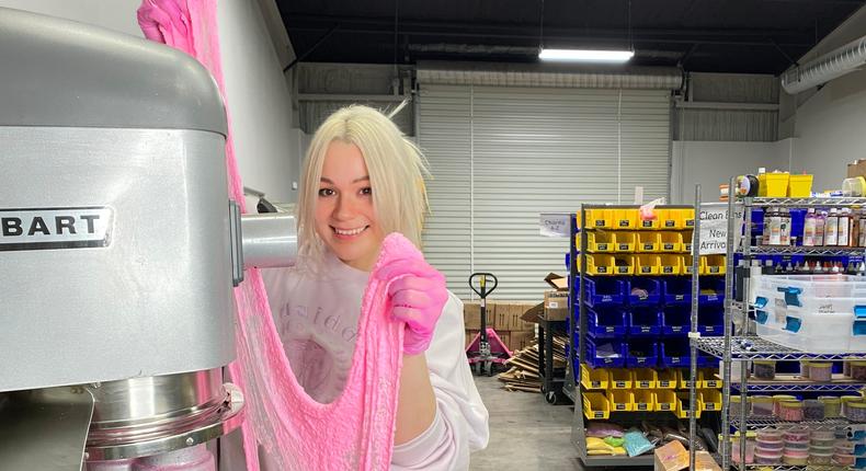 Peachybbies founder Andrea O. making a batch of pink slime in the manufacturing warehouse.