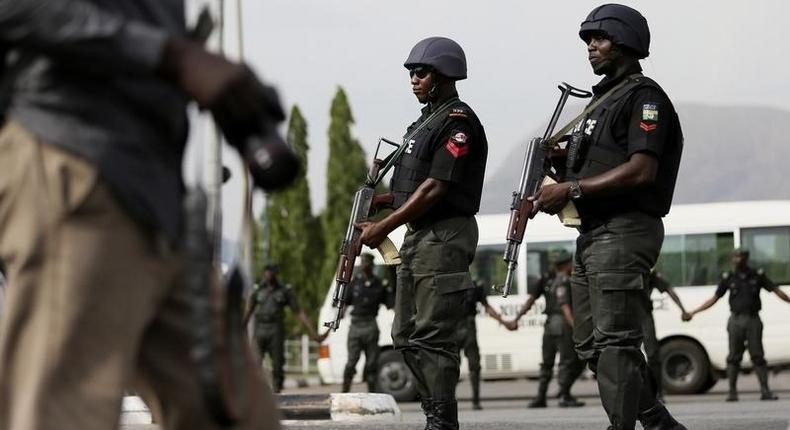 Bayelsa Election: Police, army, DSS, others tighten security at INEC headquarters/Illustration (PM News)