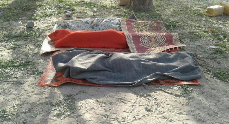 Bodies covered with blankets are pictured in Rann, northeast Nigeria on January 17, 2017 after an an air force jet accidentally bombarded a camp for displaced people