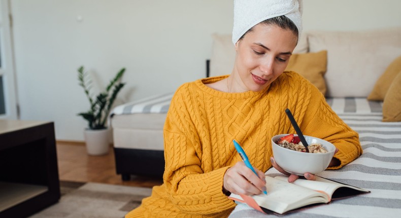 Writing down your meals before you eat can help make your food journal more accurate.RgStudio/Getty Images