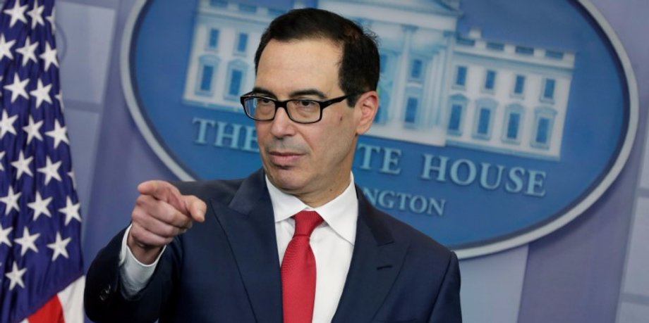 U.S. Treasury Secretary Mnuchin gestures during a news briefing at the White House in Washington