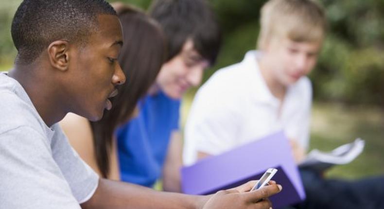 A student Playing with a phone