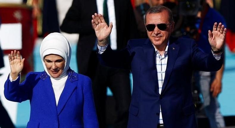 Turkish President Tayyip Erdogan, accompanied by his wife Emine Erdogan, greets supporters during a rally to mark the 563rd anniversary of the conquest of the city by Ottoman Turks, in Istanbul, Turkey, May 29, 2016. 