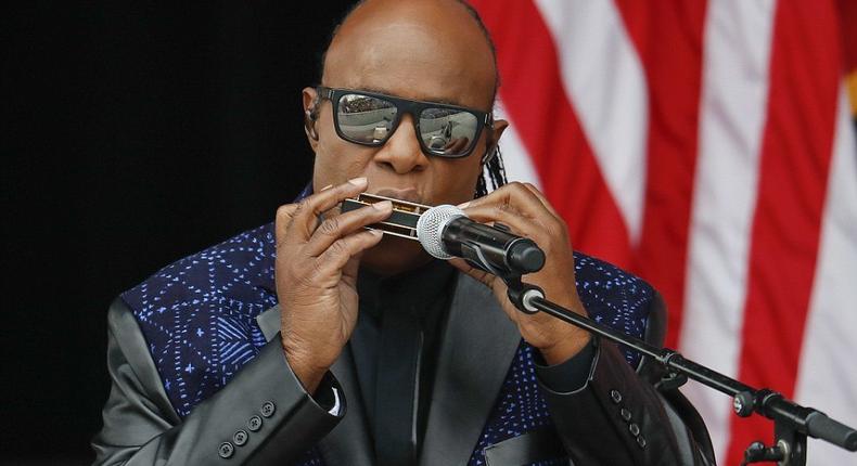 Stevie Wonder playing his harmonica before Obama's speech