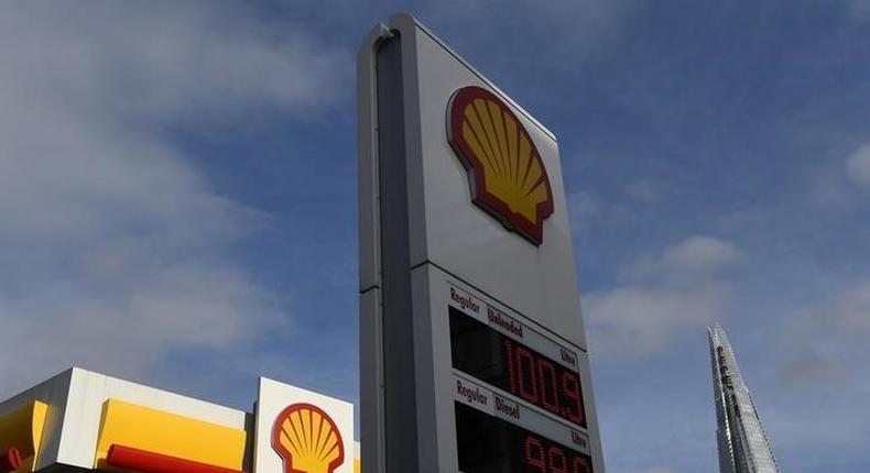 The UK £ sterling price per litre of different blends of refined petrol   is seen at a Shell fuel station, with the Shard skyscraper seen behind, in central London, Britain January 25, 2016. REUTERS/Toby Melville