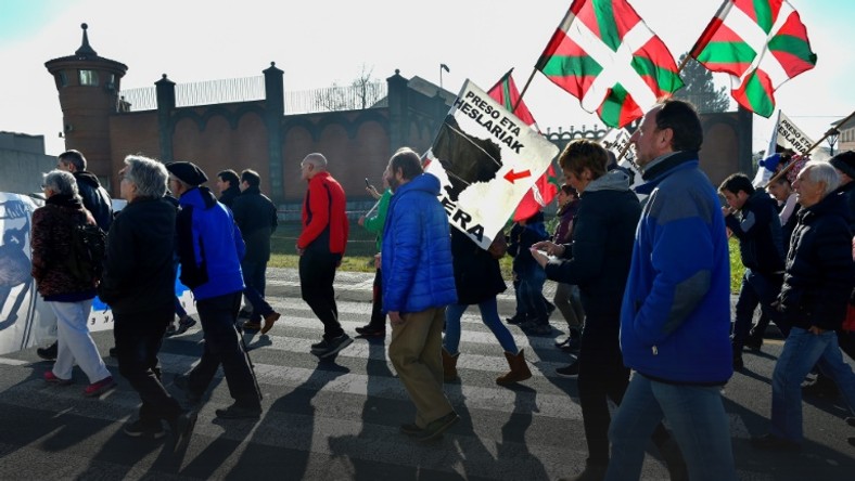 People holding Basque flags demonstrated in December outside Basauri jail near Bilbao for the release of ETA-linked prisoners -- but some relatives of the group's victims strongly oppose detainees being brought closer to home