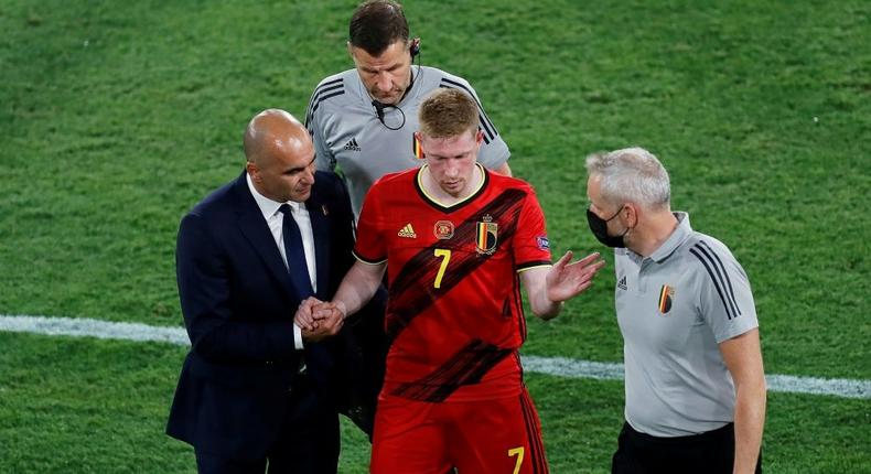 Belgium coach Roberto Martinez (L) hopes to have playmaker Kevin De Bruyne (C) fit to face Italy Creator: Jose Manuel Vidal