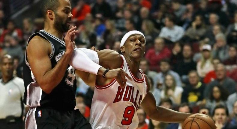 Rajon Rondo of the Chicago Bulls moves against Tony Parker of the San Antonio Spurs at the United Center in Chicago