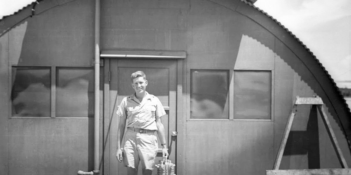 Harold Agnew carrying the plutonium core of the Nagasaki "Fat Man" bomb in 1945.