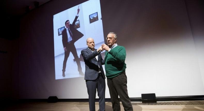 Winner of the World Press Photo 2016, photographer Burhan Ozbilici (R), with Managing Director of the World Press Photo Foundation Lars Boering during the announcement of the World Press Photo prizes in Amsterdam, on February 13, 2017