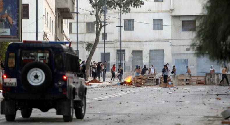 Demonstrators clash with Moroccan security forces on July 20, 2017, in the northern restive city of Al-Hoceima