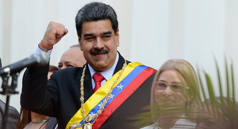 Venezuela's President Nicolas Maduro, waves as he arrives at the National Constituent Assembly's building during the celebration rally of the 20th anniversary of the Venezuelan Constitution in Caracas, Venezuela, Sunday, Dec. 15, 2019. (AP Photo/Matias Delacroix)