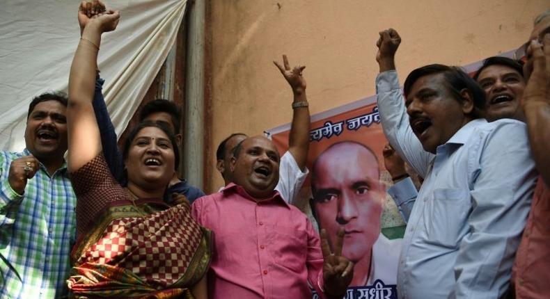 Friends of Indian national Kulbhushan Jadhav celebrate in Mumbai on May 18, 2017 after he is given a stay of execution in a high-profile case at the International Court of Justice