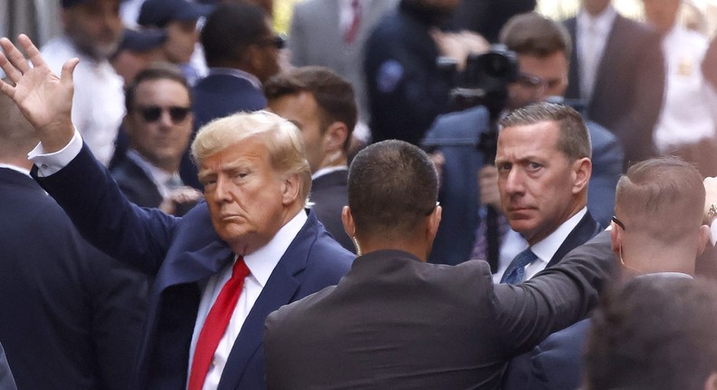 Former U.S. President Donald Trump waves as he arrives at the Manhattan Criminal Court on April 4, 2023.Kena Betancur/Getty Images