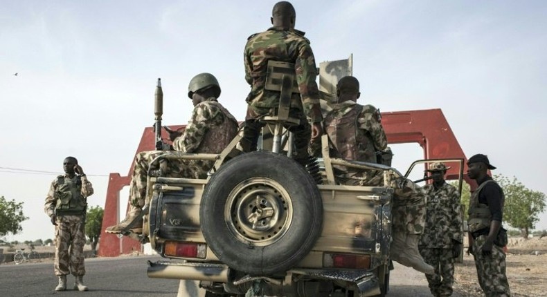 Nigerian soldiers prepare to head off in search for Boko Haram militants outside Maiduguri in Borno State, northeast Nigeria on March 25, 2016