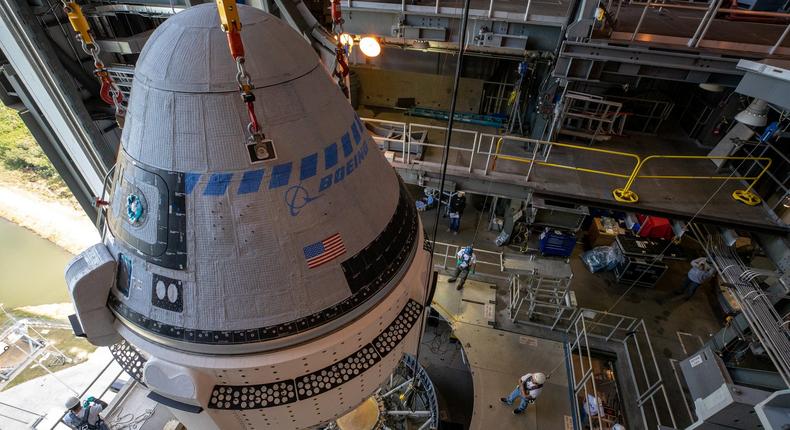 The Boeing CST-100 Starliner spacecraft is guided into position above an Atlas V rocket for an uncrewed test flight.NASA/Cory Huston via Reuters