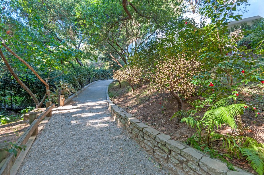 The home is set behind a gate, at the end of a private road.