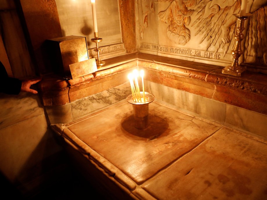 Candles placed on top of the tomb after its restoration in March.