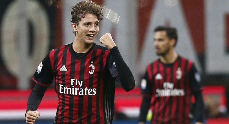 AC Milan's midfielder Manuel Locatelli celebrates after scoring (L) during the Italian Serie A football match AC Milan versus Juventus on October 22, 2016