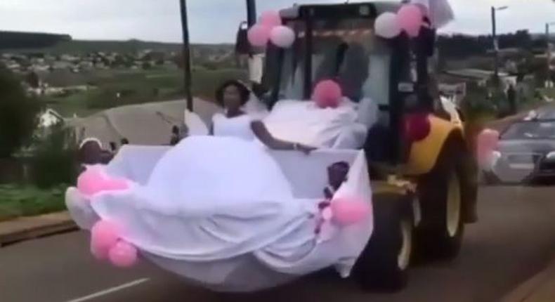 Newly wedded couple uses forklift as wedding car