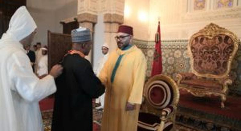 Nigeria’s Ambassador to Morocco, Mr. Baba Garba (m) being congratulated by King Mohammed VI, after conferment with Wissam Al Alaoui at the Royal Palace in Rabat, Morocco on Sunday. [NAN]