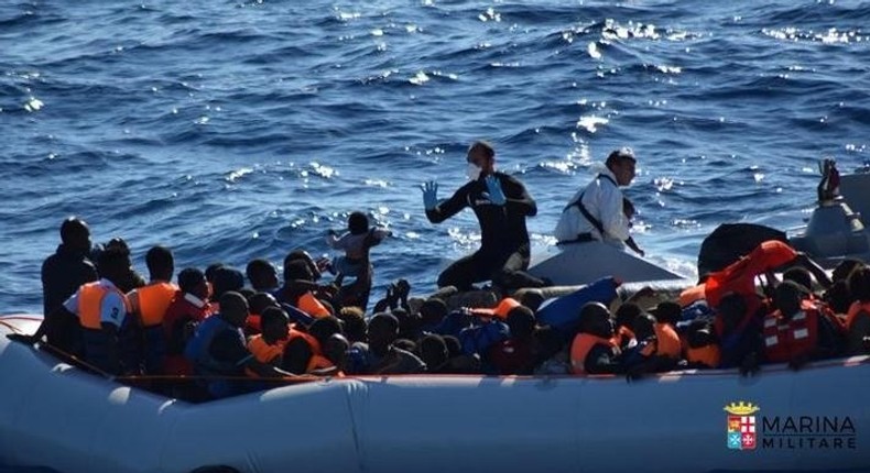 Migrants sit in their rubber dinghy during a rescue operation by Italian navy ship Borsini (unseen) off the coast of Sicily, Italy, in this handout picture courtesy of the Italian Marina Militare released July 19, 2016. Marina Militare/Handout via