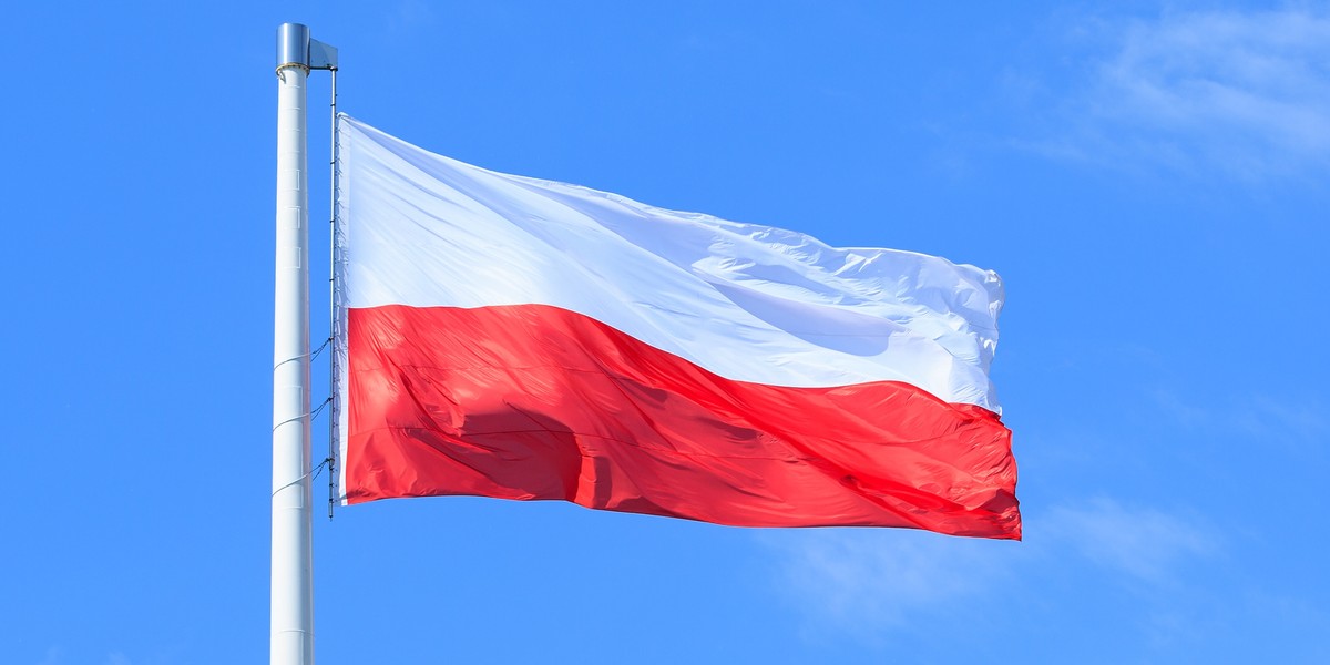 Polish flag on a background of blue sky