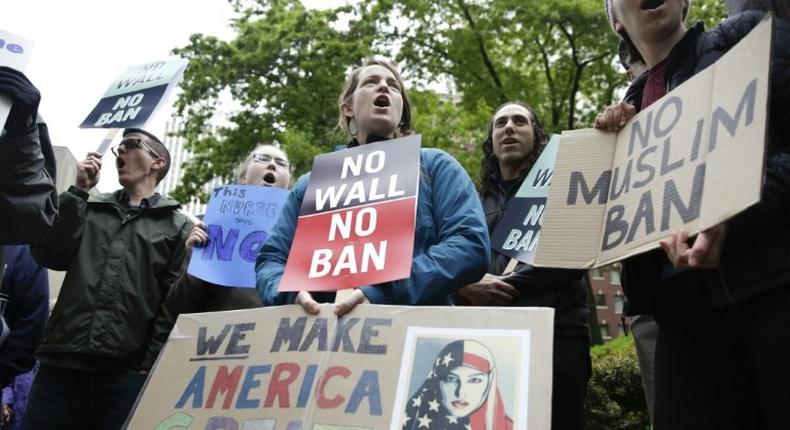 People protest outside the 9th US Circuit Court of Appeals in Seattle, Washington on May 15, 2017