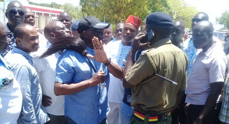 Former Machakos Senator Johnstone Muthama attempts to negotiate with police at Ukunda showground
