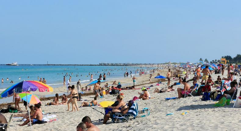 Beachgoers take advantage of the opening of South Beach on June 10, 2020, in Miami Beach, Florida.