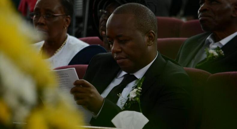 Janet Kanini's husband during her requiem service