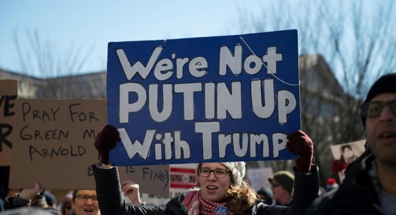 People protest outside the White House on February 4, 2017