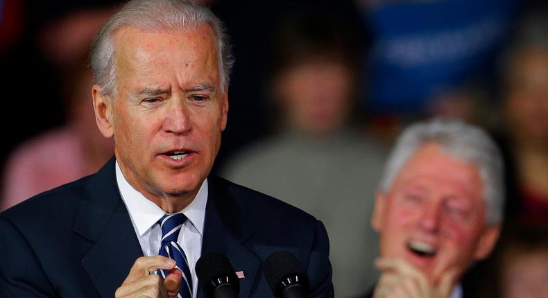 Former president Bill Clinton laughs as Vice President Joe Biden speaks during a campaign rally at the Covelli Centre, Monday, Oct. 29, 2012, in Youngstown, Ohio.