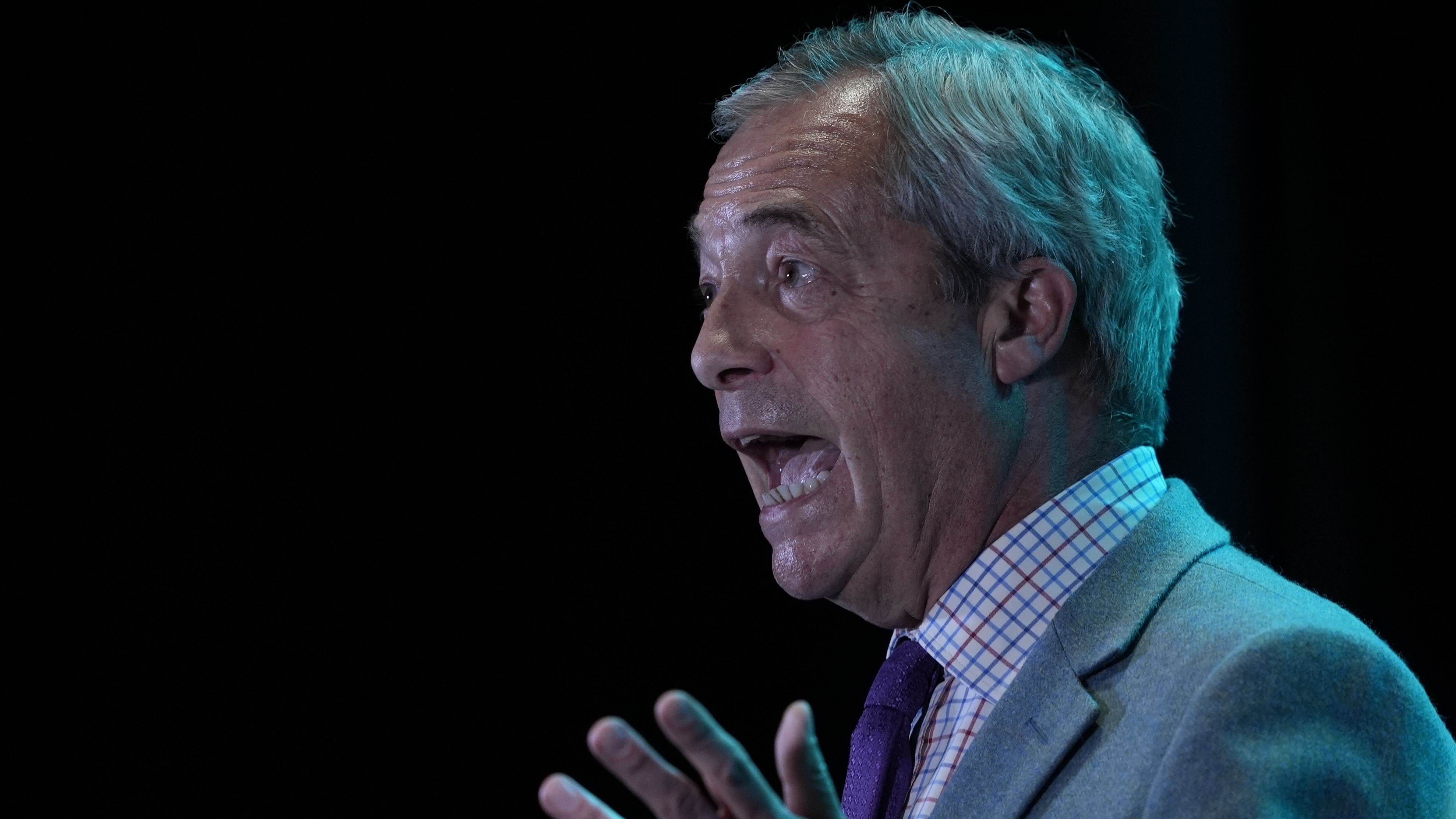 Farage denies racism as suspended MP appears at his rally