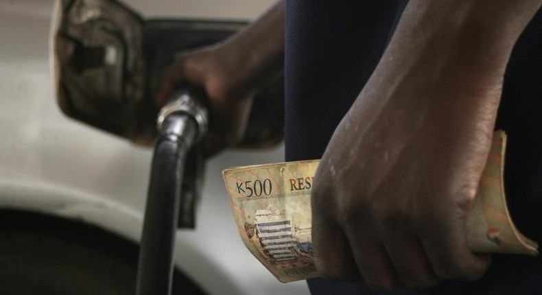 Motorists pumps fuel into his vehicle in the commercial capital Blantyre in this picture taken March 26, 2012. REUTERS/Eldson Chagara