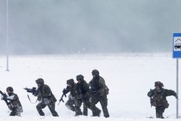 Canadian troops along with other troops from11 NATO nations take part in the exercise in urban warfare during Iron Sword exercise in the mock town near Pabrade