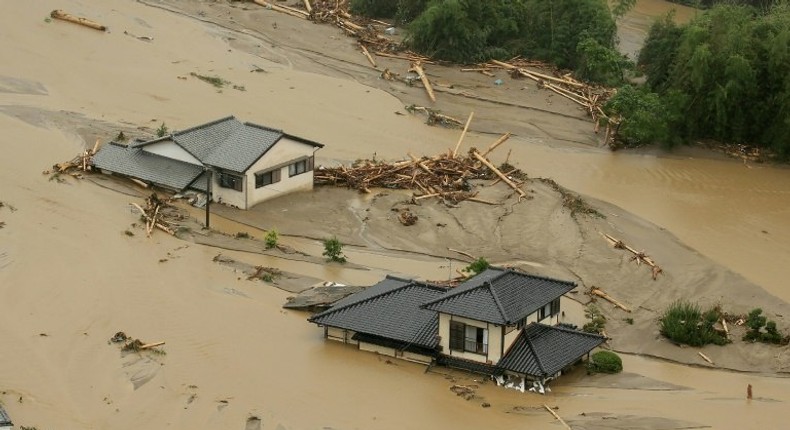 This aerial view shows homes flooded and buried in dirt in the city of Asakura, Fukuoka prefecture, on July 6, 2017