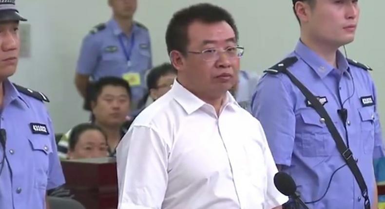 This handout video frame grab taken and released by Changsha Intermediate People's Court on August 22, 2017 shows Chinese rights lawyer Jiang Tianyong (C) appearing in court in Changsha