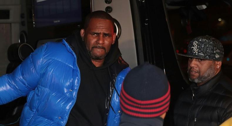 R&B singer R. Kelly is shown arriving at a Chicago police station on February 22, 2019, a day before a court set bail at $1 million on 10 charges of sexual abuse