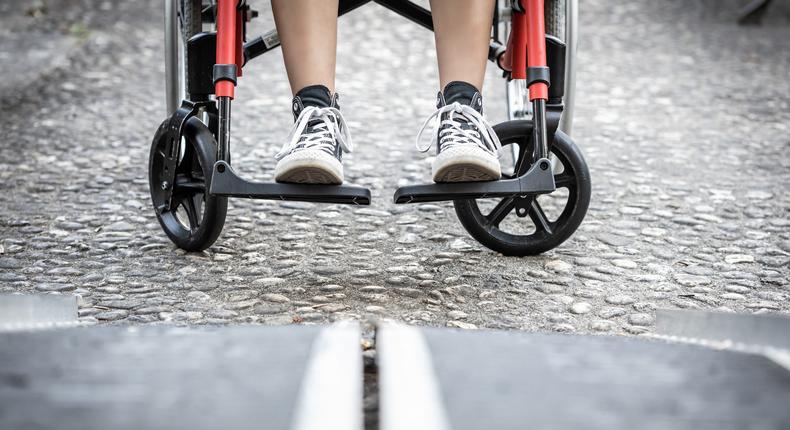 A stock image image of a person prepared to board a wheelchair ramp.Manu Vega/Getty Images