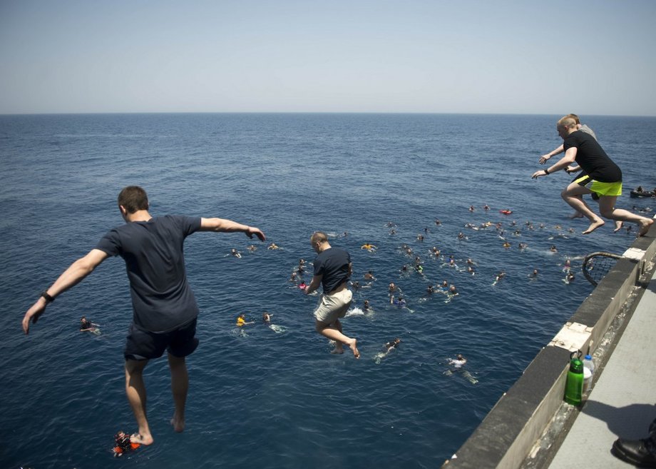 sailors-jump-from-the-aircraft-carrier-uss-dwight-d-eisenhower-in-the-north-arabian-sea