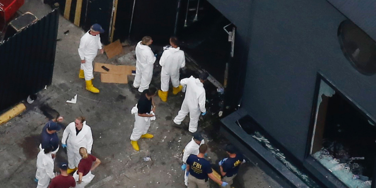 Police forensics investigators at the crime scene of the mass shooting at the Pulse gay nightclub in Orlando, Florida, on Sunday.