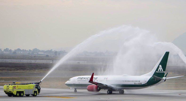 Mexicana Boeing 737 getting a water salute at the military-run airport in Mexico City before taking off for Tulum.Mexico Presidency/Handout via Reuters