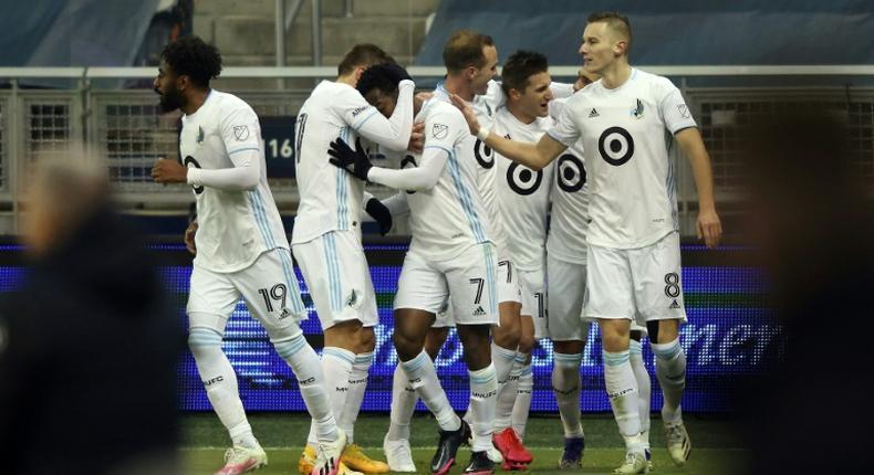 Minnesota United players celebrate with Kevin Molino (7) after a goal during the first half of the MLS playoff game against Sporting Kansas City